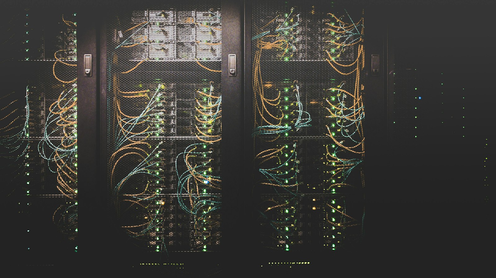 Server room aisle lit in blue