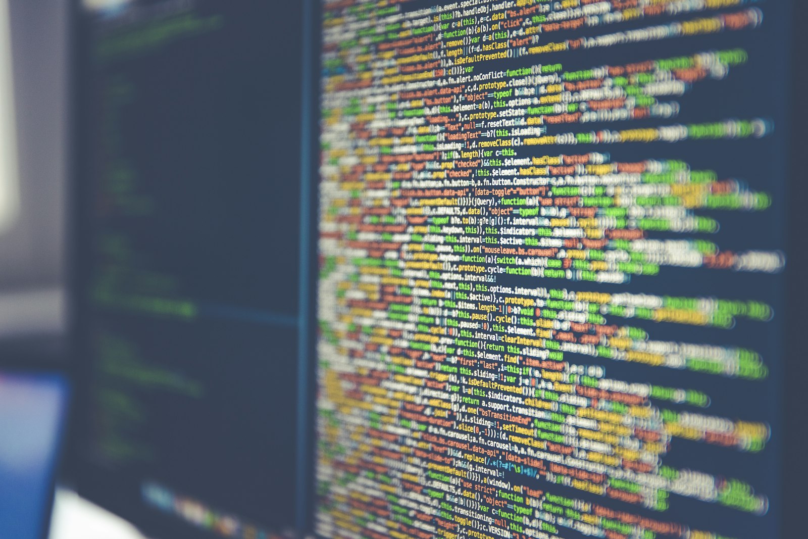 Colorful programming code on a dark screen